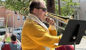 trombonist leading processional into Palm Sunday